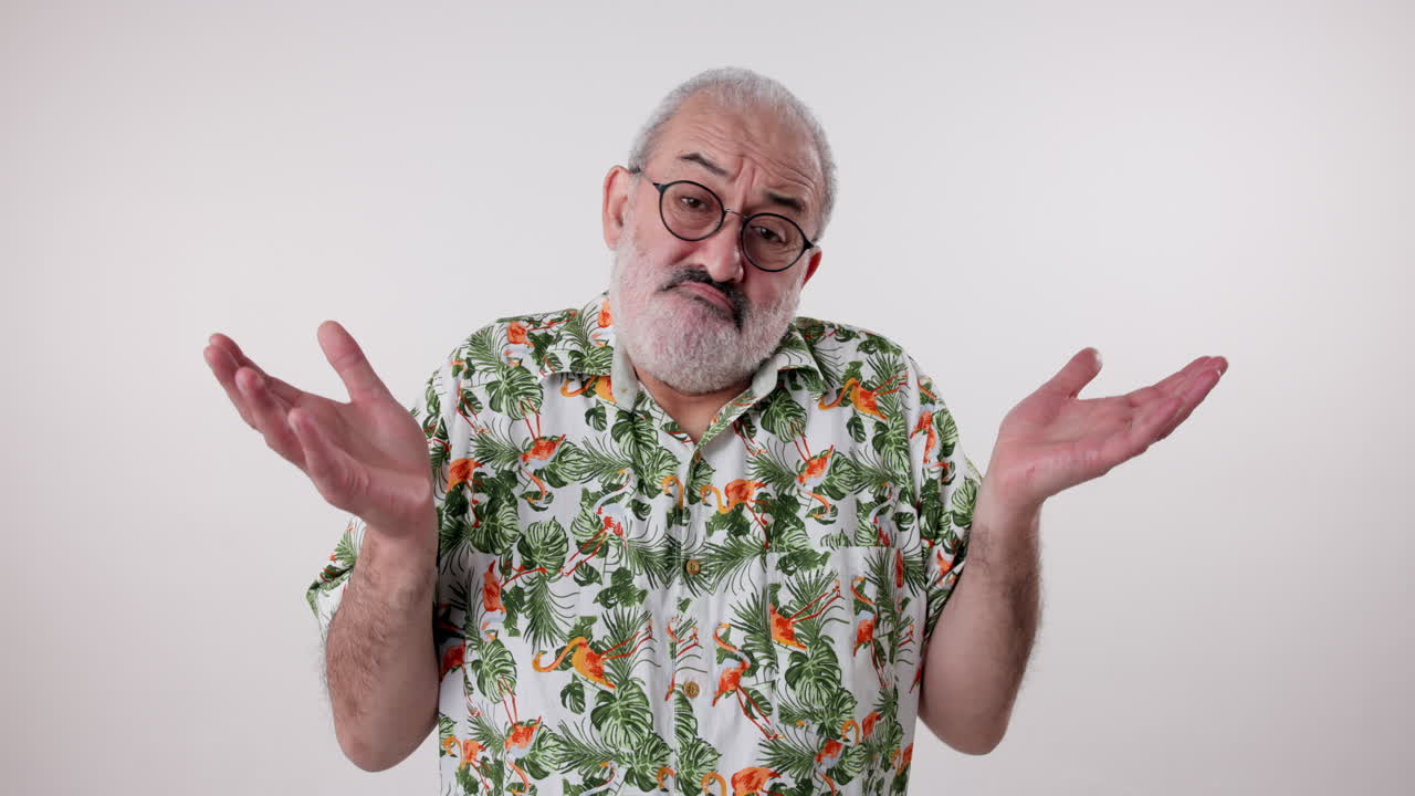 Man shrugging in Hawaiian shirt