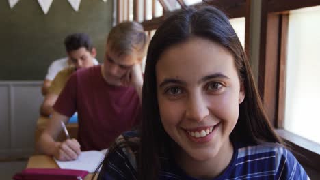 Portrait-of-teenage-girl-in-a-school-classroom