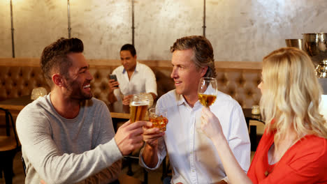 Group-of-friends-having-drink-while-talking-with-each-other-4K-4k