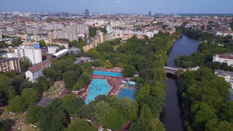 magic aerial top view flight public swimming pool prinzenbad, city berlin germany summer day 2023