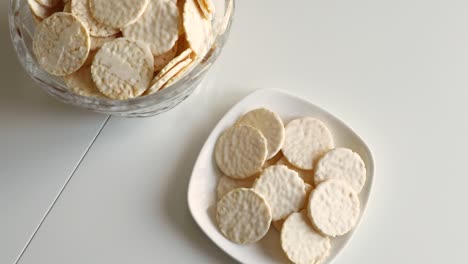 round cookies in white chocolate on a white table. sweet morning.