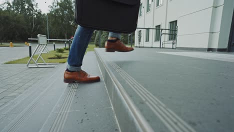 business person walking up stairs
