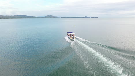 fly over of a small motor boat in the indian ocean off madagascar