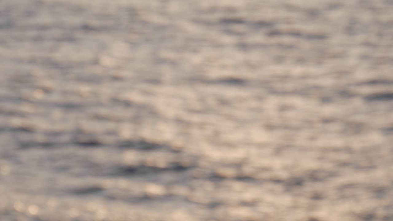 Golden sunset over the sea at Cova D'En Xoroi, Menorca, with a calm and serene mood