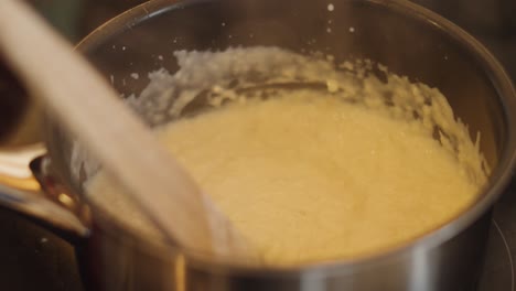 close up of thickened bread sauce after adding milk and stirring to thicken. side dish served with roast dinners.