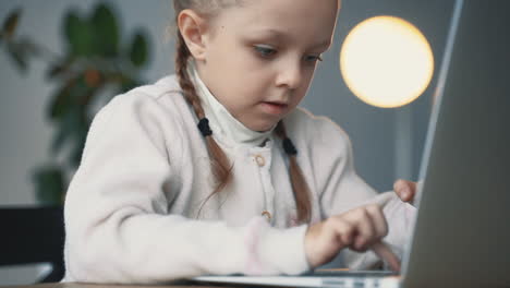 little girl researching with a computer