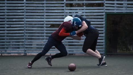 american football players engaging in a play on the field