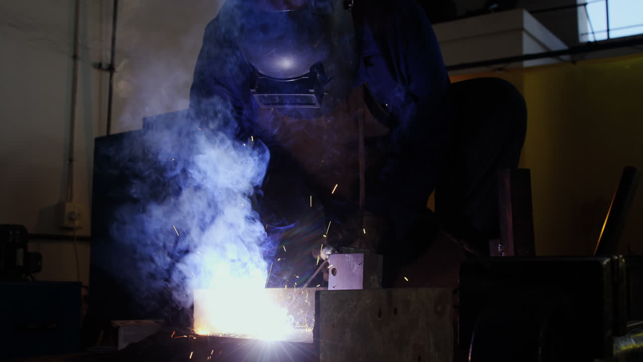 Welder welding a metal