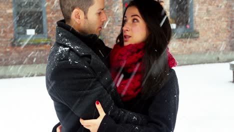 Couple-interacting-with-each-other-under-umbrella