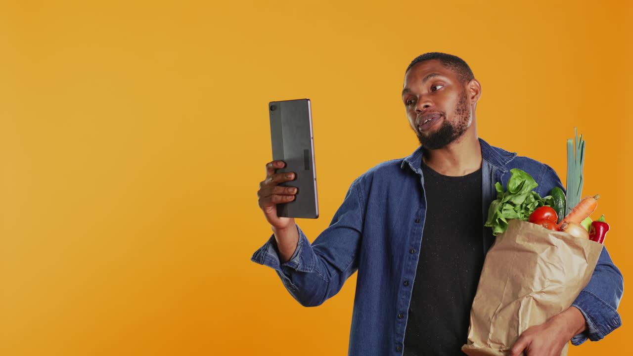 Cheerful guy recommends bio homegrown goods on video call