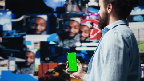 male web user navigates phone with copy space for social media platforms