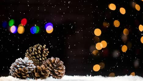 Animation-of-snow-falling-over-pine-cones-and-colorful-bokeh