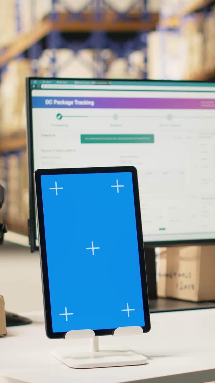 Vertical Video Male warehouse clerk printing barcode labels next to chroma key displays