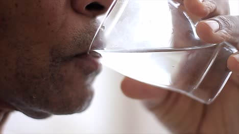 man drinking water from a glass on white background stock video stock footage