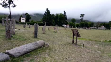 panning shot across stone monument layout of los manhires archaeological reserve