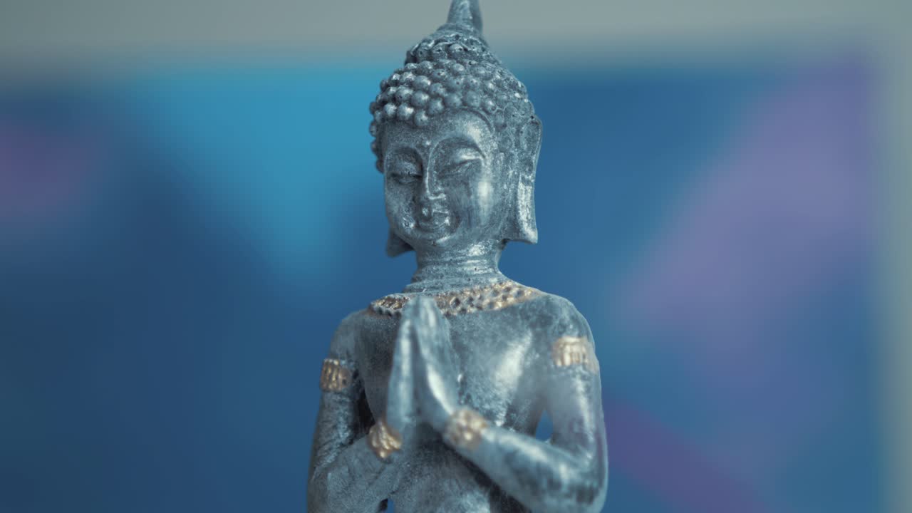Buddha praying ornament tilt-up reveal shot