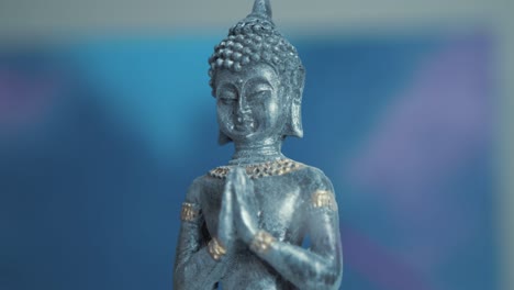 buddha praying ornament tilt-up reveal shot