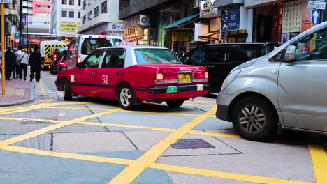 taxis and pedestrians navigate crowded city streets