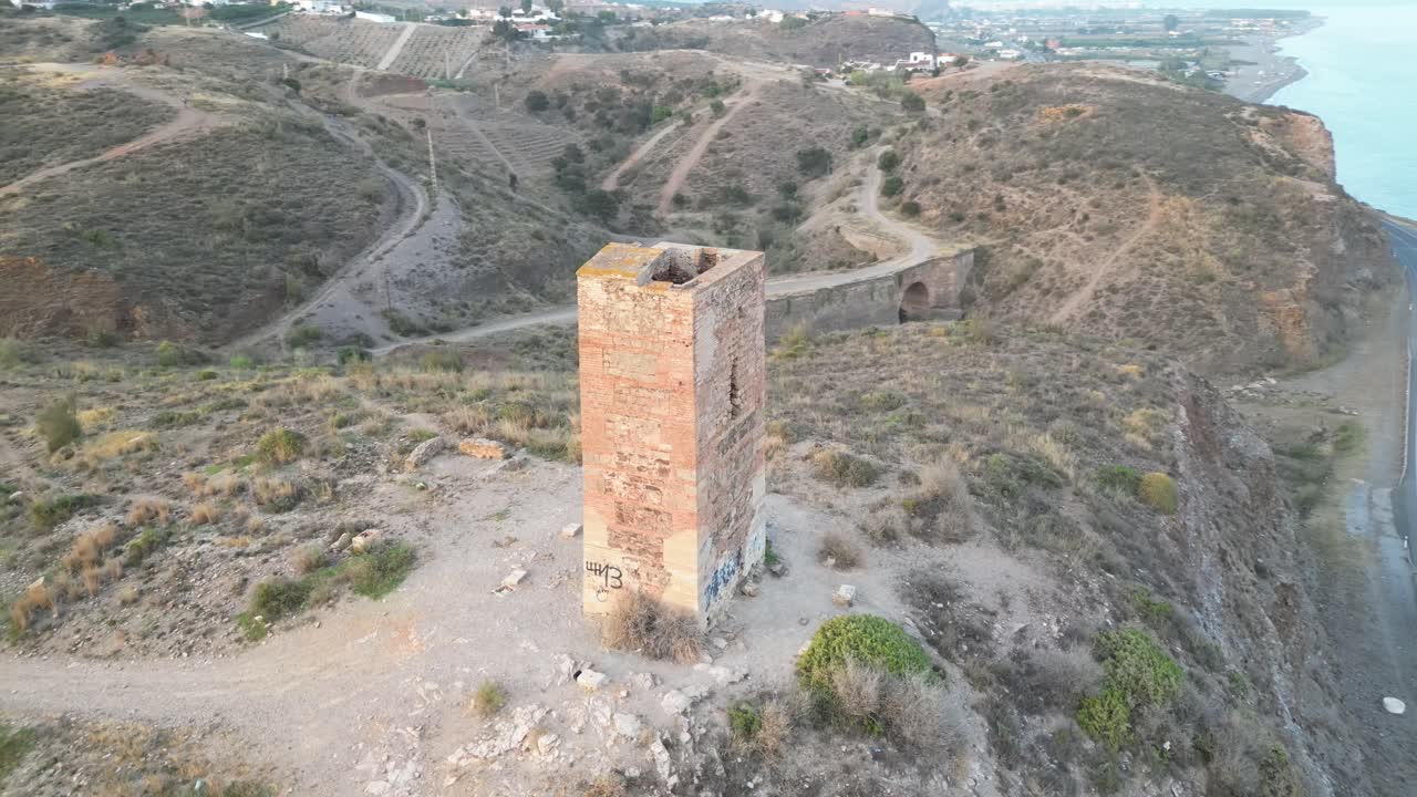 Experience the historic Tower of Jaral in Almayate Bajo from a mesmerizing drone's-eye view