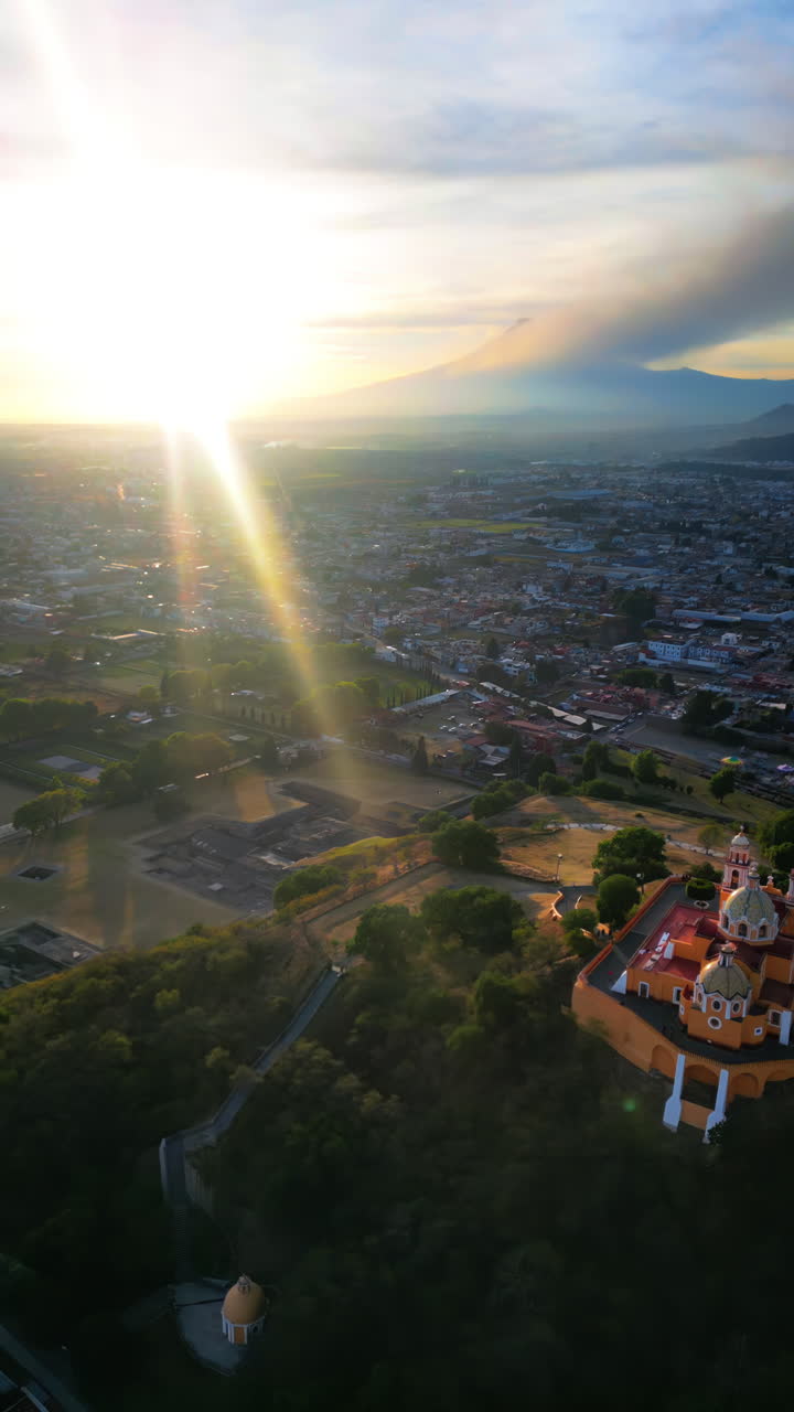Aerial drone view of the Great Pyramid and Church of Our Lady of Remedies in Cholula, Mexico. Vertical