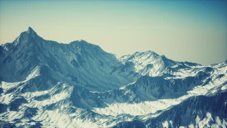 aerial view of the alps mountains in snow
