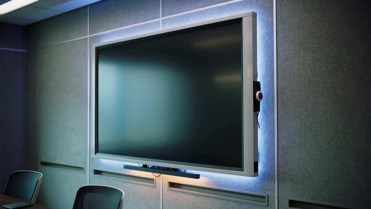 Receiving power, display powering up and settling to black in meeting room, LED halo and red-button