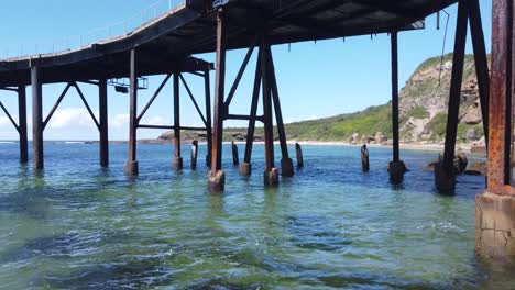 Aerial-shot-of-old-rugged-ocean-pier