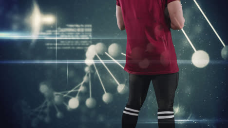 estructuras moleculares contra la vista trasera de un jugador de rugby masculino
