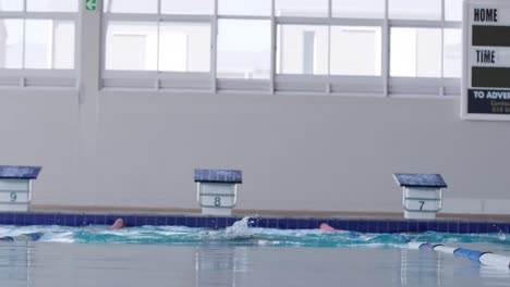 swimmer swimming into the pool