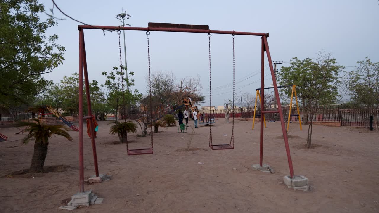 Kids and Adults Enjoying Outdoor Park with Swing and Activities at Evening video is taken at pachetia hill outdoor park jodhpur rajasthan india on Aug 19 2024.