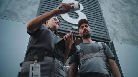 warehouse workers discussing delivery and logistics