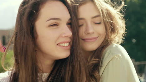 two friends hugging outdoors