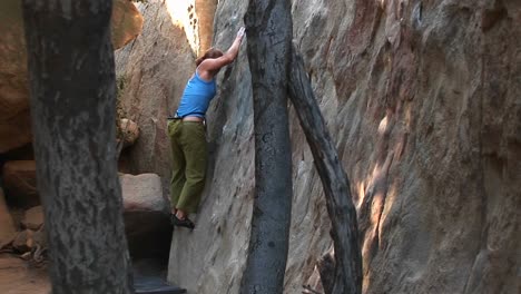 A-Rising-Shot-Of-A-Woman-Starting-A-Free-Climb