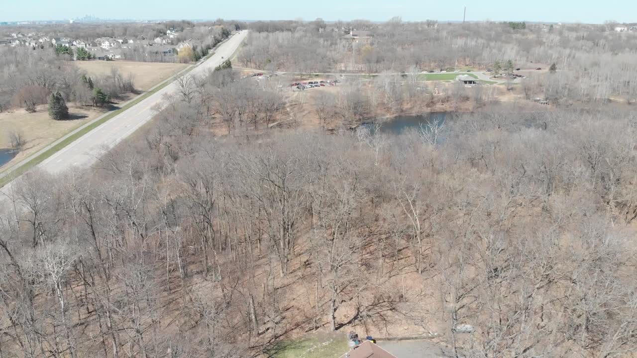 House inside trees at Minnesota during dry season, sunny day