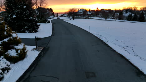 winter sunrise with snow in upscale american neighborhood