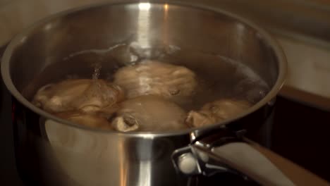 eggs boiling in a pan