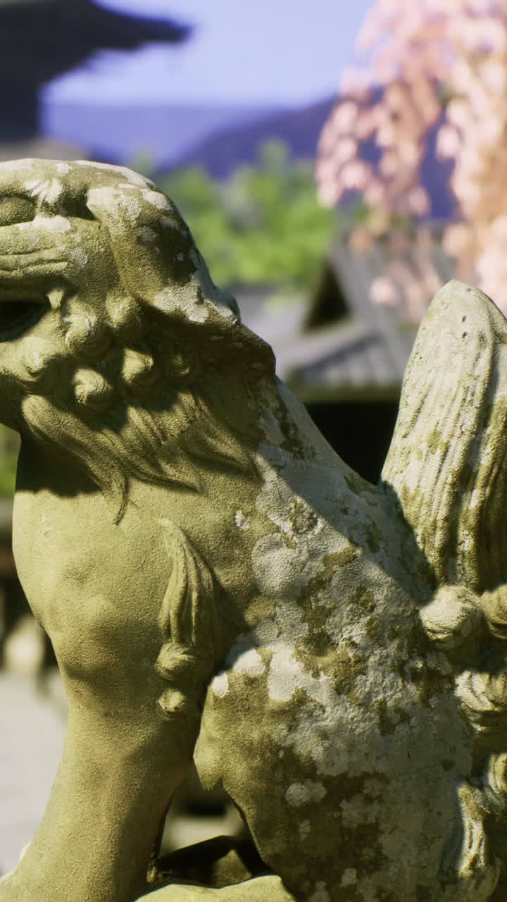 Stone lion statue with wings and moss in garden during daytime