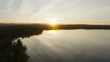 tranquility of lake during sunrise in the province of quebec in canada