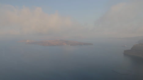view of the majestic santorini seascape including the volcano island of nea kameni