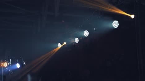 lightning background of bright spotlights in the nightclub inside.