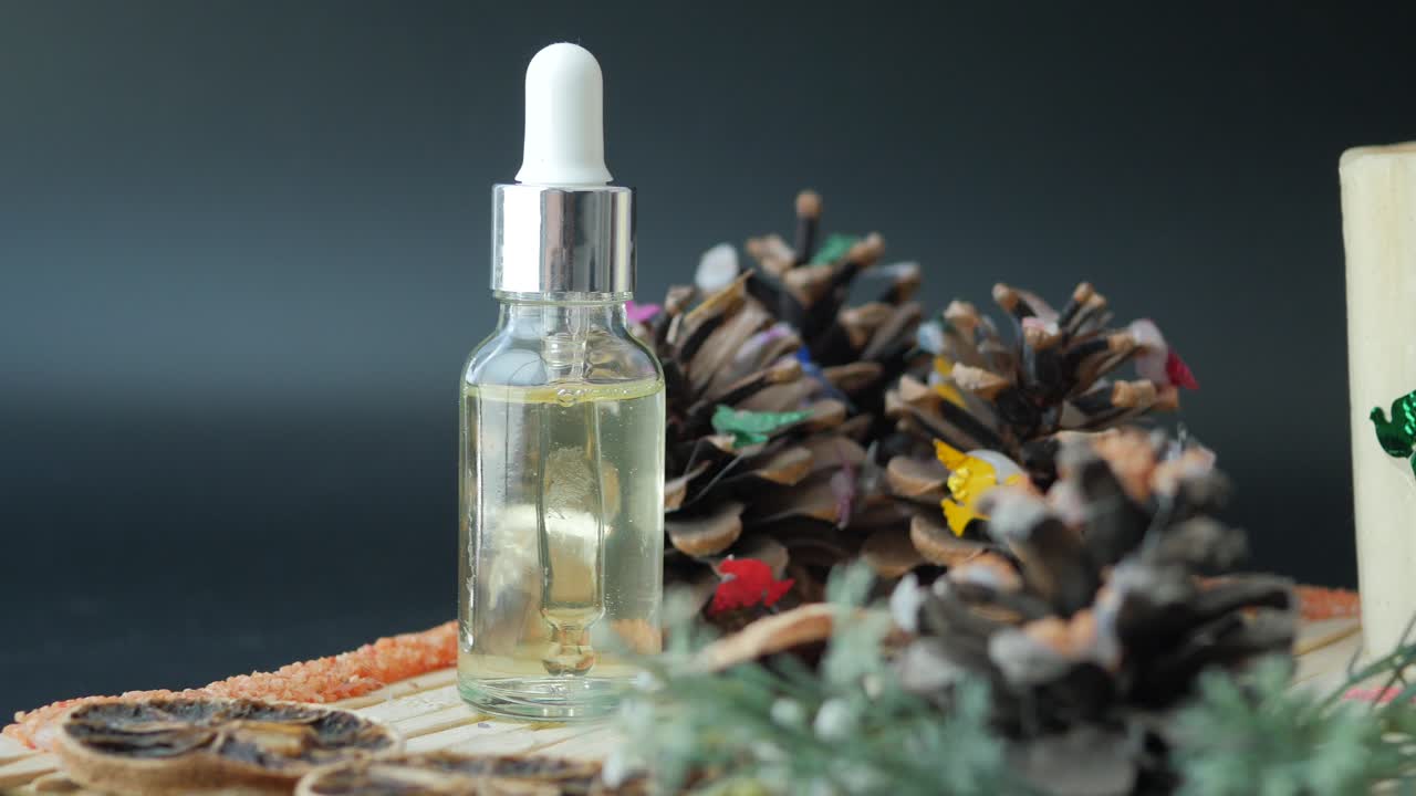 Essential Oil Serum with Pine Cone Decorations