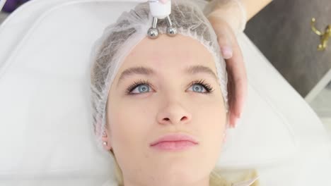 Woman Receiving Microcurrent Facial Treatment