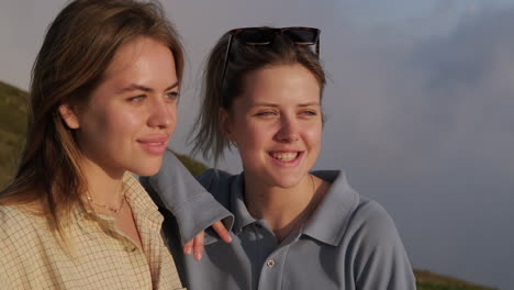 two friends enjoying a sunset view