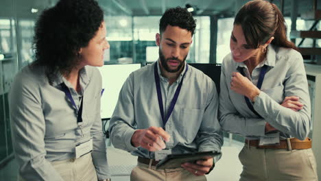 Business Team Discussing a Tablet in an Office