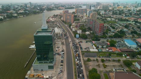 traffic and cityscape of falomo bridge, lagos law school and the civic centre tower in lagos nigeria