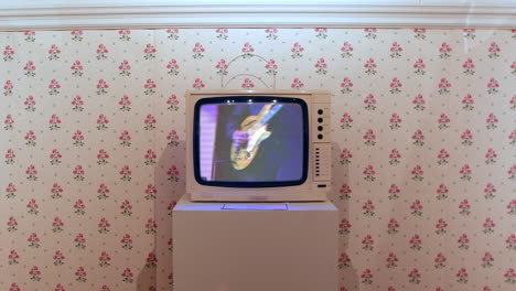 wide shot of an eighties white television