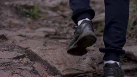 person hiking on a rocky trail