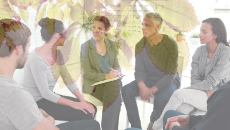 animation of leaves over diverse people participating in group therapy