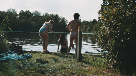 friends relaxing by the lake