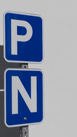 blue p and n parking signs